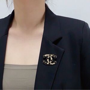 Gold and Black Star Brooch